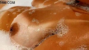 Tanned Stepsis Teases Big Tits and Pussy in Bathroom - Watch Her!