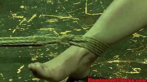 A bound sub endures domination torment from vibrating toys and rough play.