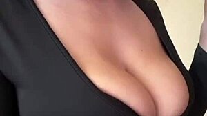 check out these big milky tits spilling from her black dress