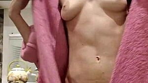 raven-haired petite rubs tight pussy with toys in kitchen