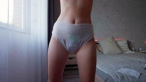 Kinky Teen Pees in Diaper While Masturbating