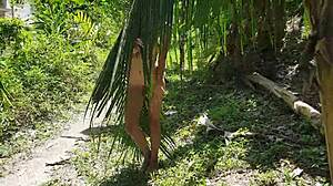 A naked girl poses wild in Amazon jungle