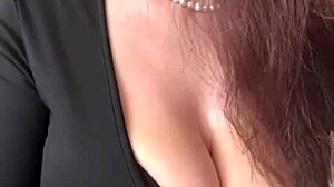 check out these big milky tits spilling from her black dress