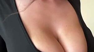 check out these big milky tits spilling from her black dress