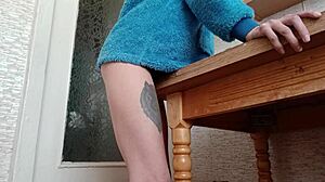 hey, watch this skinny brunette rub pussy on kitchen counter...