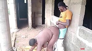 electrician pounds boss lady outdoors by factory house