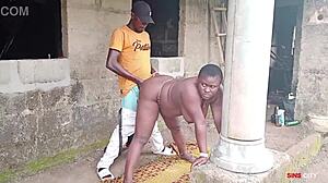 electrician pounds boss lady outdoors by factory house
