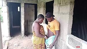 electrician pounds boss lady outdoors by factory house
