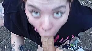 Skinny tattooed babe sucks cock in public yard