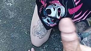 Skinny tattooed babe sucks cock in public yard