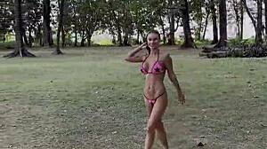 Monika Fox's pink bikini barely hides her stars as she poses teasingly on the beach