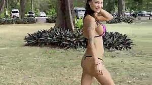 Monika Fox's pink bikini barely hides her stars as she poses teasingly on the beach