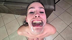 Human toilet gulps piss gargling with lip retractor pov