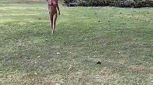 Monika Fox's pink bikini barely hides her stars as she poses teasingly on the beach