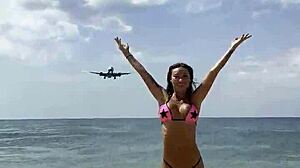 Monika Fox's pink bikini barely hides her stars as she poses teasingly on the beach