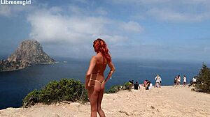she flashes her shaved pussy naked on the beach and streets