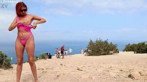 she flashes her shaved pussy naked on the beach and streets