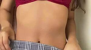 Pretty petite teen in skirt dances panties aside fingering pussy to orgasm toys