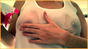 wife flaunts her huge braless tits in wet singlet