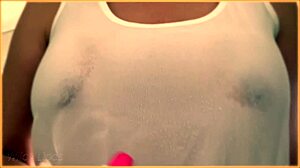 wife flaunts her huge braless tits in wet singlet