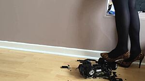high heels crush toy car in garage play