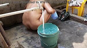 Wet Indian Bhabhi's Big Boobs and Cute Pussy Bath Outdoors