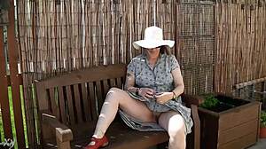 naughty housewife strips naked outdoors in lush garden