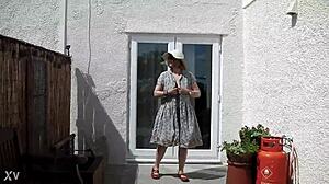 naughty housewife strips naked outdoors in lush garden