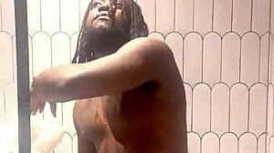busty babe oils slick tits and ass in shower