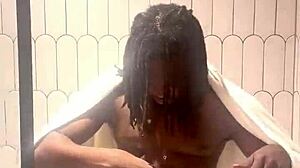 busty babe oils slick tits and ass in shower