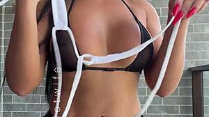 married babe tests her naughty sheer bikinis on the balcony view