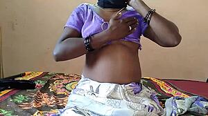 Girl inserts vibrator deep into her pussy on bed