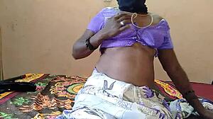 Girl inserts vibrator deep into her pussy on bed