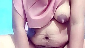 indonesian hijab girl dildo fucks to wet orgasm