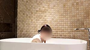 relaxing bath in luxury hotel room with slim beauty