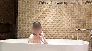 relaxing bath in luxury hotel room with slim beauty
