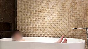 relaxing bath in luxury hotel room with slim beauty
