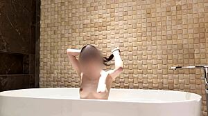 relaxing bath in luxury hotel room with slim beauty