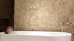relaxing bath in luxury hotel room with slim beauty