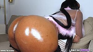 big ebony booty grinds as he oils and rubs her cheeks
