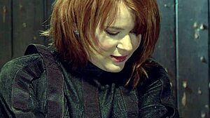 redhead bound in straitjacket squirts from rough whipping torment