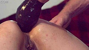 porno slut's coochie stretched by gloved fist