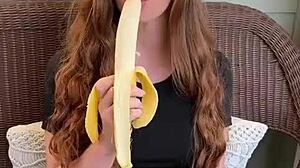 uhh ruiva's long hair sways as she sucks that banana deep mmm