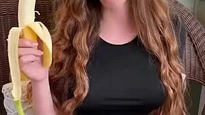 uhh ruiva's long hair sways as she sucks that banana deep mmm