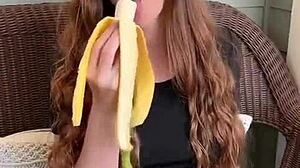 uhh ruiva's long hair sways as she sucks that banana deep mmm