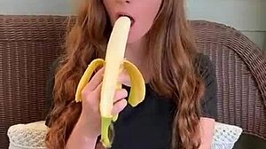 uhh ruiva's long hair sways as she sucks that banana deep mmm