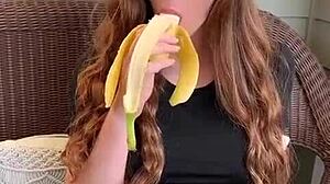 uhh ruiva's long hair sways as she sucks that banana deep mmm