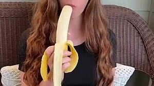 uhh ruiva's long hair sways as she sucks that banana deep mmm
