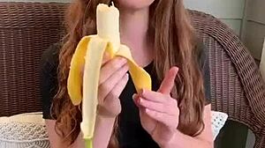 uhh ruiva's long hair sways as she sucks that banana deep mmm