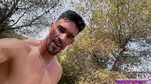 Muscular athletic guy strokes big cock naked outdoors in forest flashing